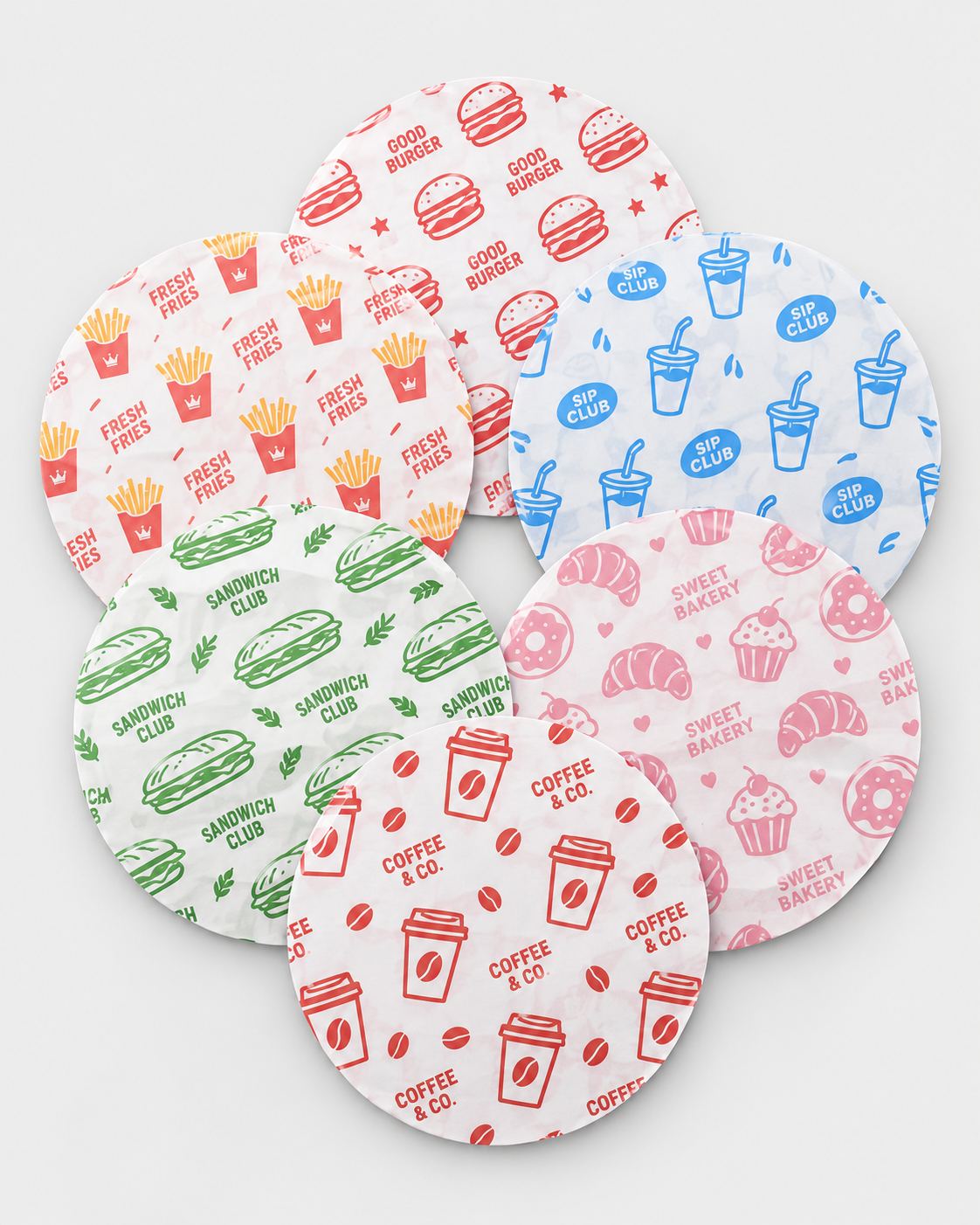 Papel antigrasa redondo personalizado — seis diseños a una tinta: burger, patatas, bebidas, bocadillos, bollería y café